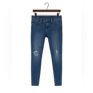Articles of Society size 25 ripped skinny jeans with frayed bottoms.